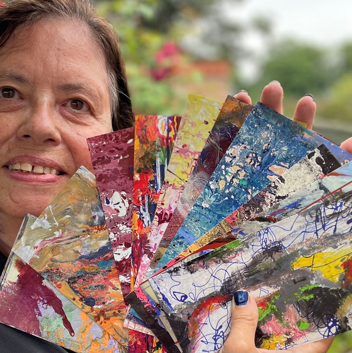 Lupe Cunha holding cards
